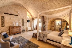 Postel nebo postele na pokoji v ubytování Masseria Cervarolo + 37 fotografií