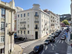a city street with cars parked in front of buildings at BOA LISBOA 3 bedroom spacious apartment in Lisbon