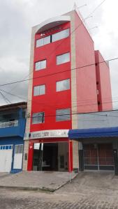 a red building on the side of a street at Hotel Ruy Barbosa in Eunápolis