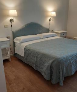 Krevet ili kreveti u jedinici u okviru objekta Il Grifo Camere e Suites