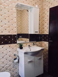 a bathroom with a sink and a mirror at Albomi in Kotor +21 photos