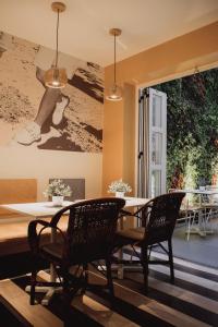 a dining room with a table and chairs at room Select Sol in Madrid