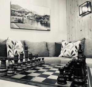 a living room with a chess board on a couch at Silver Creek Hotel in Hailey