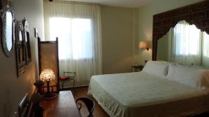Postel nebo postele na pokoji v ubytování Hotel Katxi