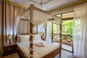 מיטה או מיטות בחדר ב-Amani Luxury Apartments