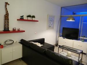 Telewizja i/lub zestaw kina domowego w obiekcie Moderno apartamento Torremolinos centro