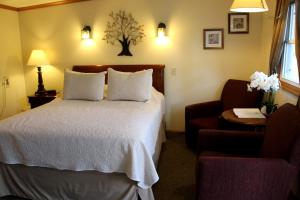 Postel nebo postele na pokoji v ubytování All Seasons Inn