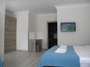 Postel nebo postele na pokoji v ubytování Sava Hotel