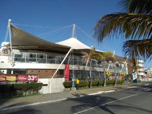 a building with a tent on the side of a street at Terrazzas Flat in João Pessoa