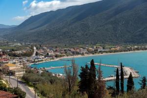 a view of a city and a river with mountains at Amazing View Home in Plataria