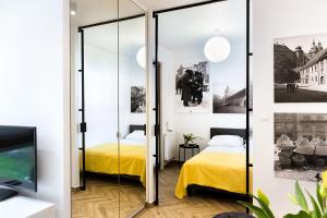 Posteľ alebo postele v izbe v ubytovaní apartamenty Stary Kraków GO