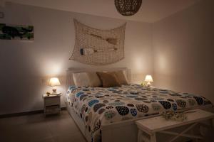 En eller flere senge i et værelse på Il Balconcino nel Vicolo Short Lets