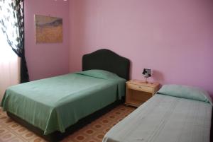מיטה או מיטות בחדר ב-"LA CASETTA"