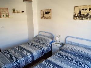 Posteľ alebo postele v izbe v ubytovaní Fantástico apartamento en la playa + 25 fotografií