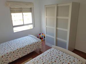 Posteľ alebo postele v izbe v ubytovaní Fantástico apartamento en la playa