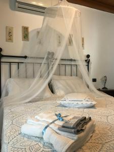A bed or beds in a room at B&B La Casa della Nonna