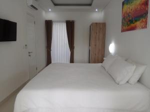Tempat tidur dalam kamar di The Bali Bubble