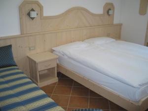 Łóżko lub łóżka w pokoju w obiekcie Bellavista B&B