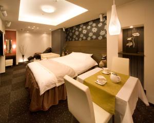 Ein Bett oder Betten in einem Zimmer der Unterkunft Carrot ISE (Adult Only)