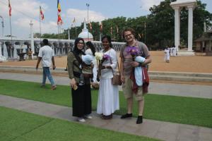 a group of people posing for a picture in a park at Miheen Hotel & Resort - Anuradhapura in Mihintale