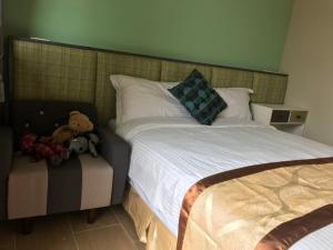 Rúm í herbergi á Good Nest Homestay