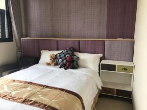 Rúm í herbergi á Good Nest Homestay