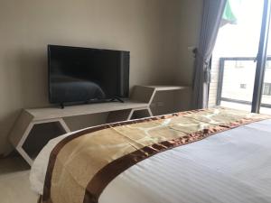 Sjónvarps- og/eða afþreyingartæki á Good Nest Homestay