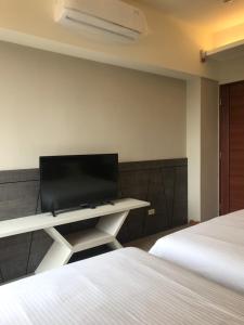 Rúm í herbergi á Good Nest Homestay