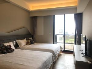 Rúm í herbergi á Good Nest Homestay