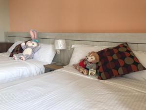 Rúm í herbergi á Good Nest Homestay