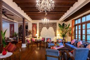 
a living room filled with furniture and decor at Ariyasom Villa - SHA Extra Plus in Bangkok
