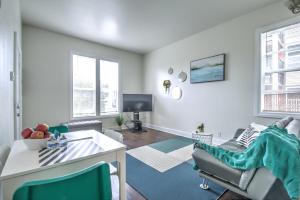 a living room with a table and chairs at Capitol Hill Luxury Apartments in Seattle