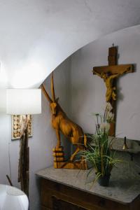 a statue of a deer on a table in a room at Pension Lex in Bad Reichenhall