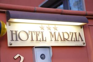 a sign on the side of a building at Hotel Marzia in Scandicci