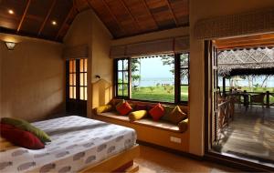 Letto o letti in una camera di Ameya Kerala