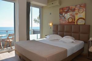 Voodi või voodid majutusasutuse Scorpios Sea Side Hotel toas