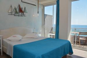 Voodi või voodid majutusasutuse Scorpios Sea Side Hotel toas