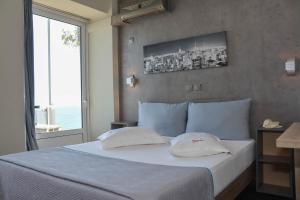 Voodi või voodid majutusasutuse Scorpios Sea Side Hotel toas