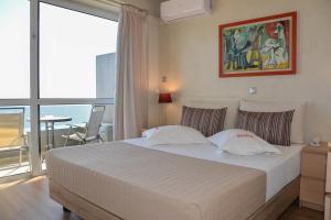 Voodi või voodid majutusasutuse Scorpios Sea Side Hotel toas