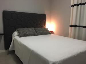 Ένα ή περισσότερα κρεβάτια σε δωμάτιο στο Apartamento Albufereta, Condomina 19