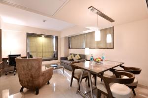 Posezení v ubytování Krishna Palace Hotel - Ambernath