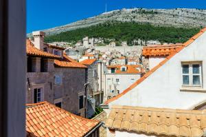 a view of a city from the roofs of buildings at Villa Flores in Dubrovnik