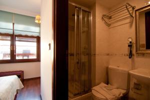 a bathroom with a shower and a toilet and a sink at Emine Sultan Hotel in Istanbul
