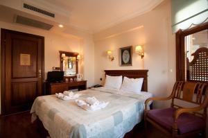 a hotel room with a bed with towels on it at Emine Sultan Hotel in Istanbul +37 photos
