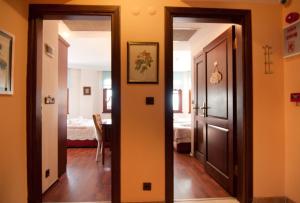 a hallway with a door and a room with a bed at Emine Sultan Hotel in Istanbul