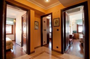 a hallway with two doors and a room with a bed at Emine Sultan Hotel in Istanbul