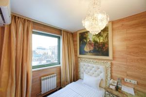a bedroom with a bed and a window at Sunflower Avenue Hotel Moscow in Moscow