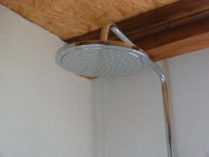a shower head on the ceiling of a bathroom at Country House Speedy in Komiža +47 photos