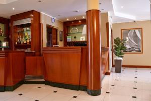 a bar in a restaurant with a pillar at Albergo Ristorante San Marco in Carmagnola