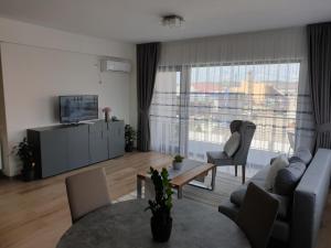 TV a/nebo společenská místnost v ubytování cosy apartment II